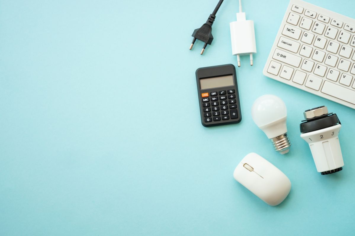 Utility payments. Electricity and heating savings. Led lamp, thermostat, calculator and laptop.