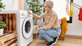 Young caucasian woman smiling confident washing clothes at laundry room Young caucasian woman smiling confident washing clothes at laundry room